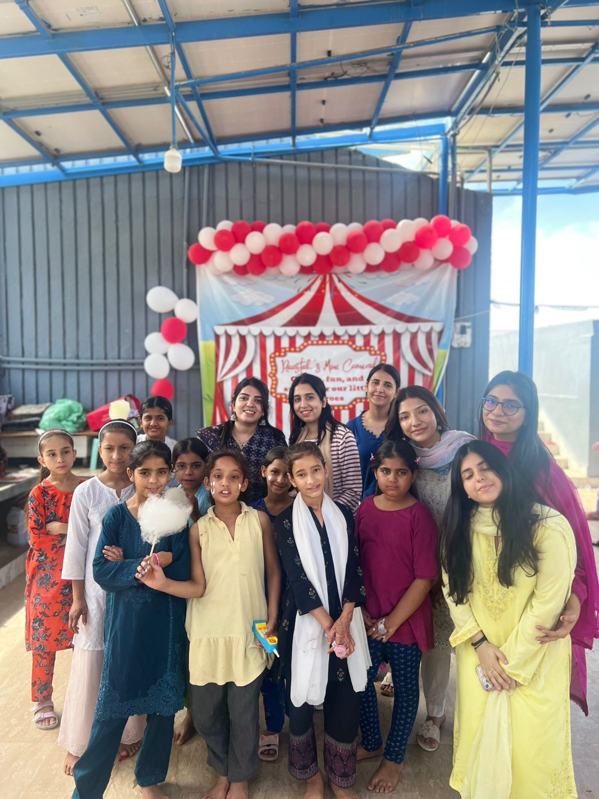 Raastah volunteers and children at a community event